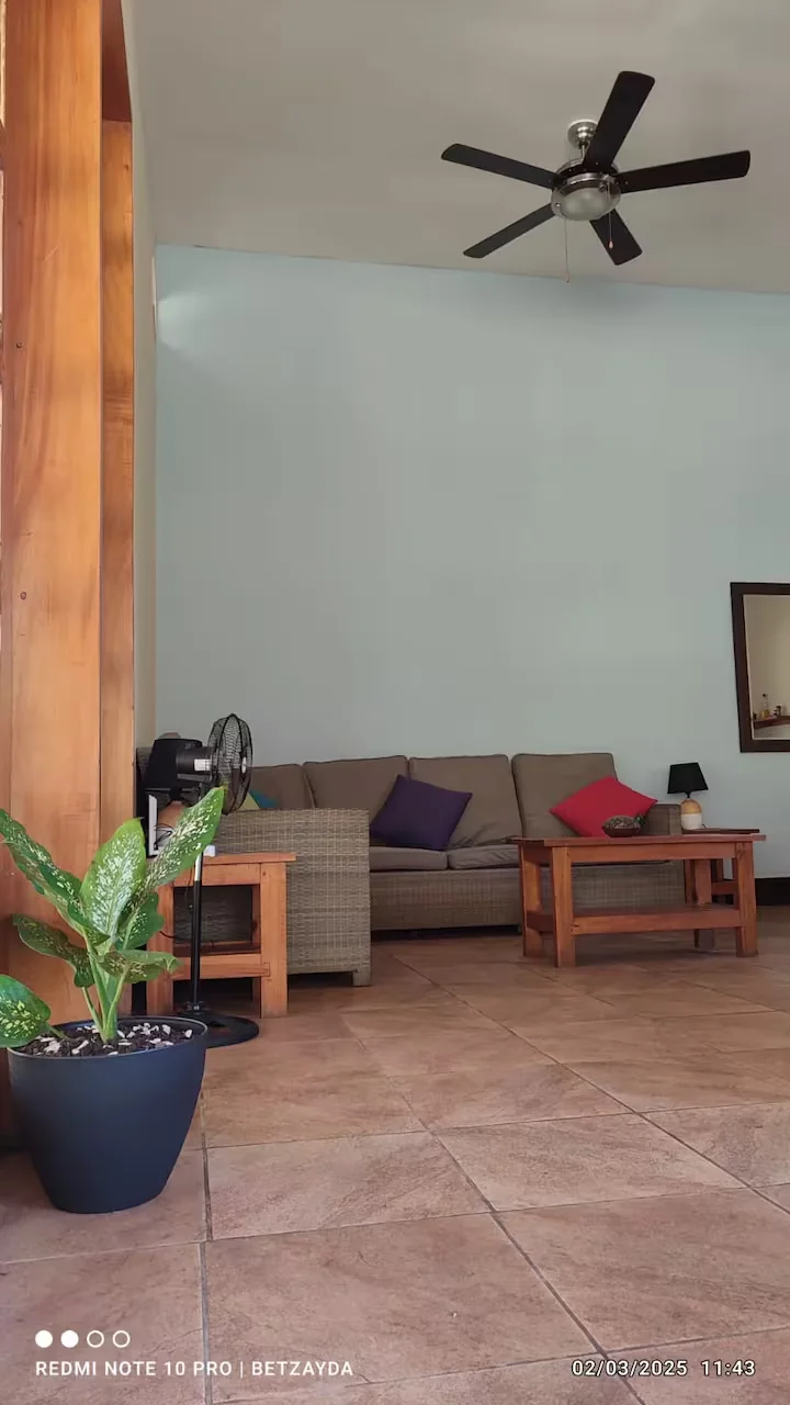 Quiet lounge area with sofa and ceiling fan